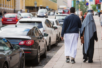 Emigrants on the street of european city