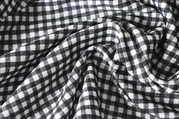 Cotton fabric natural and has a soft ripple,Grid pattern black and white and rough surface background.