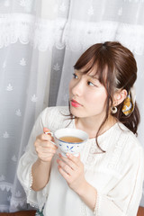 Beautiful Japanese woman enjoying tea at the balcony - 171830088