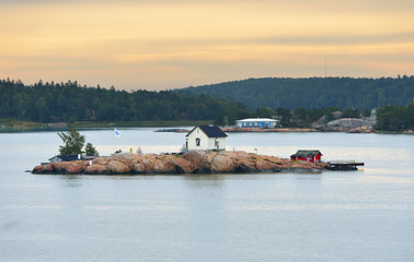 Rocky island in Turku archipelago, Finland. Early morning, gold dawn