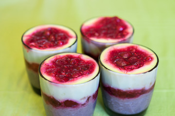 Chocolate pudding with red fruits on top