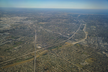 Fototapeta premium Aerial view of Santa Fe Springs, Norwalkm Bellflower, Downey, view from window seat in an airplane