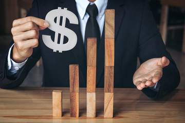 Businessman hand arranging stacking wooden blocks development as step stair, Business growth...