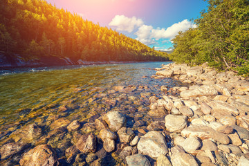 Mountain valley with the river in evening. Beautiful nature of Norway. 