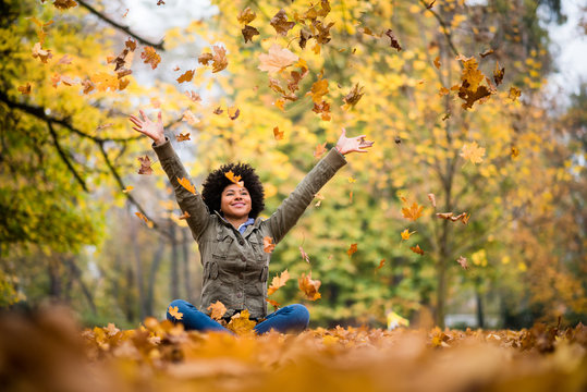 Teenage girl having fun during autumn season
