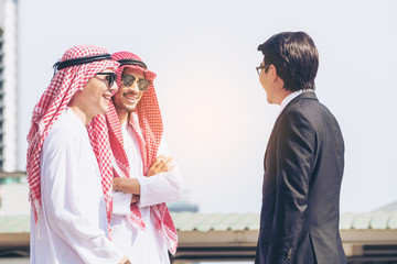 Arabic, Asian, Mexican businessmen business meeting