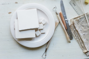 The workplace of ceramist. Blanks for painting. A creative workshop . Minimalistic composition in bright colors
