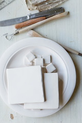 The workplace of ceramist. Blanks for painting. A creative workshop . Minimalistic composition in bright colors