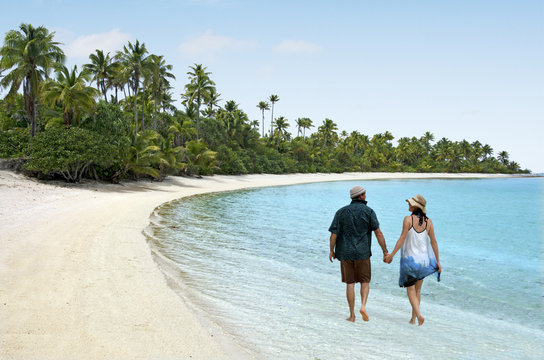 Couple Walk On One Foot Island In Aitutaki Lagoon Cook Islands