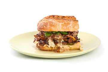 A square burger with mushrooms chanterelles in a rustic style on a clean white background..
