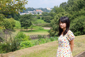 a portrait of beautiful woman in the park