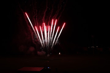 Fireworks in the sky at night during a summer festival in Tuscany, Italy