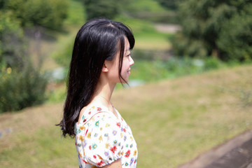 a portrait of beautiful woman in the park