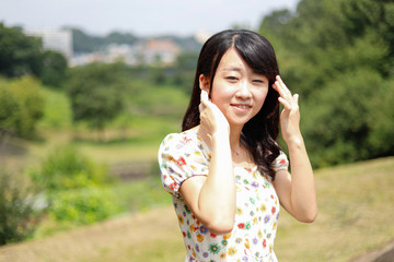 a portrait of beautiful woman in the park