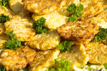 Fried potato  fritters, decorated with parsley