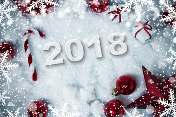 Fototapeta na wymiar Christmas decoration on snow background with 2018