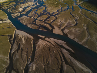 Aerial shot of river delta in valley