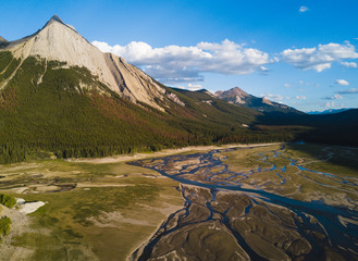 Aerial shot of river delta in valley with mountains and forest - 171849848