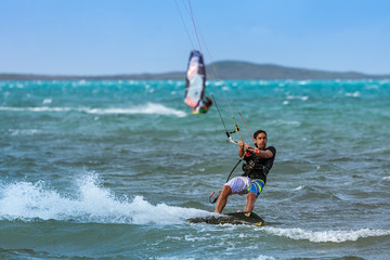 Windsurfer and kitesurfer