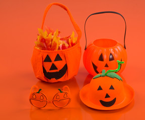 Halloween accessories on an orange background