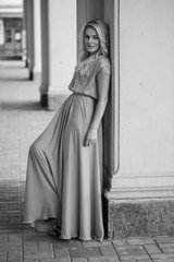 Naklejka premium portrait of a beautiful blonde near castle