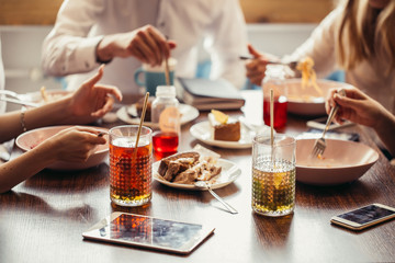 Close up cropped photo of nicely served wooden table with tasty dishes.