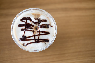 Whipped cream in takeaway cup view from the top