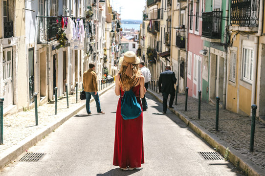 People in Lisbon - traveler on tour on city streets