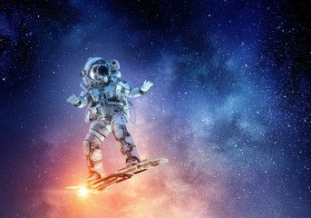 Fototapeta premium Spaceman on flying board. Mixed media