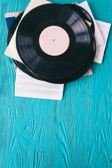 music records on wooden background