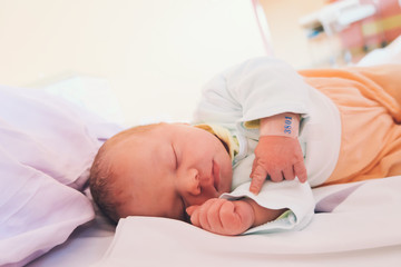 Obraz na płótnie Canvas Newborn baby first days of life after childbirth.