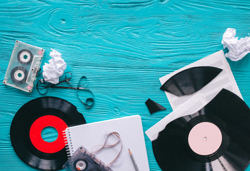 music records and notes on wooden background