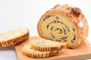 bake bread with wood grain on a block wood isolated on white background