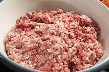 Bowl with ground turkey for delicious meatloaf, closeup