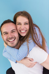 Fototapeta premium young man piggybacking his girlfriend