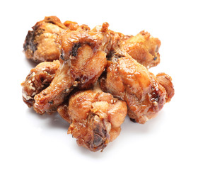 Roasted chicken legs on white background