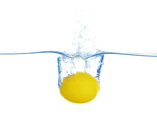 Falling lemon into water on white background