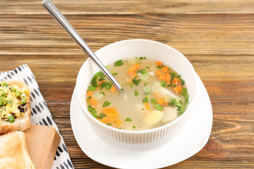 Plate with tasty soup on table. Cooking for one concept