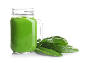 Mason jar of spinach smoothie isolated on white