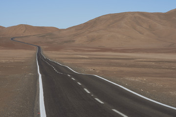 Road through the Atacama Desert to the historic coastal town of Pisagua in the Tarapaca Region of...
