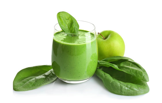 Glass of spinach smoothie isolated on white