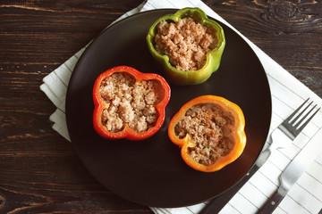 Quinoa stuffed peppers on black plate