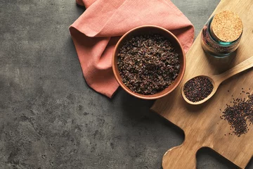Selbstklebende Fototapeten Bowl with boiled quinoa grains on kitchen table © Africa Studio