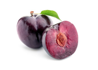 Fresh ripe plums on white background