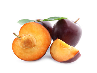 Fresh ripe plums on white background