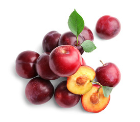 Fresh ripe plums on white background