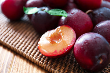 Fresh ripe plums on table, closeup