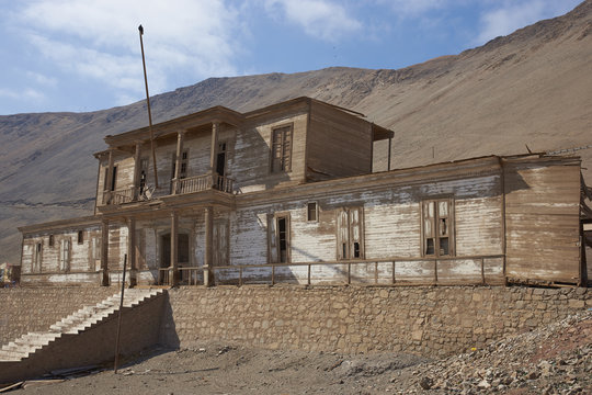 Historic wooden building from the era of nitrate mining in the Atacama Desert, in the coastal town of Pisagua in the Tarapaca Region of northern Chile.