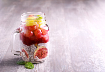 Chia seed yogurt and fruit (fig and grapes) layered healthy snack