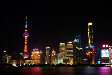 Shanghai tower long-exposure scene from the Bund area across Huangpu river at Pudong province, China at night time